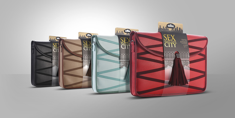 The four bag colours in a row: black, tan, aqua and red, each with its header card