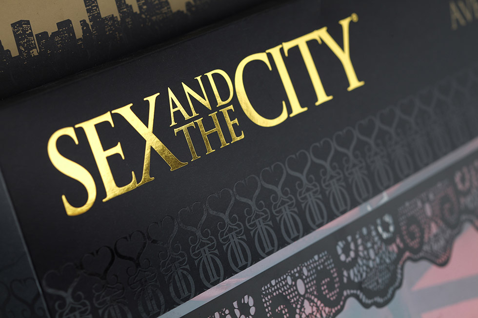 The header card close up: the title in gold on black, with a lace pattern