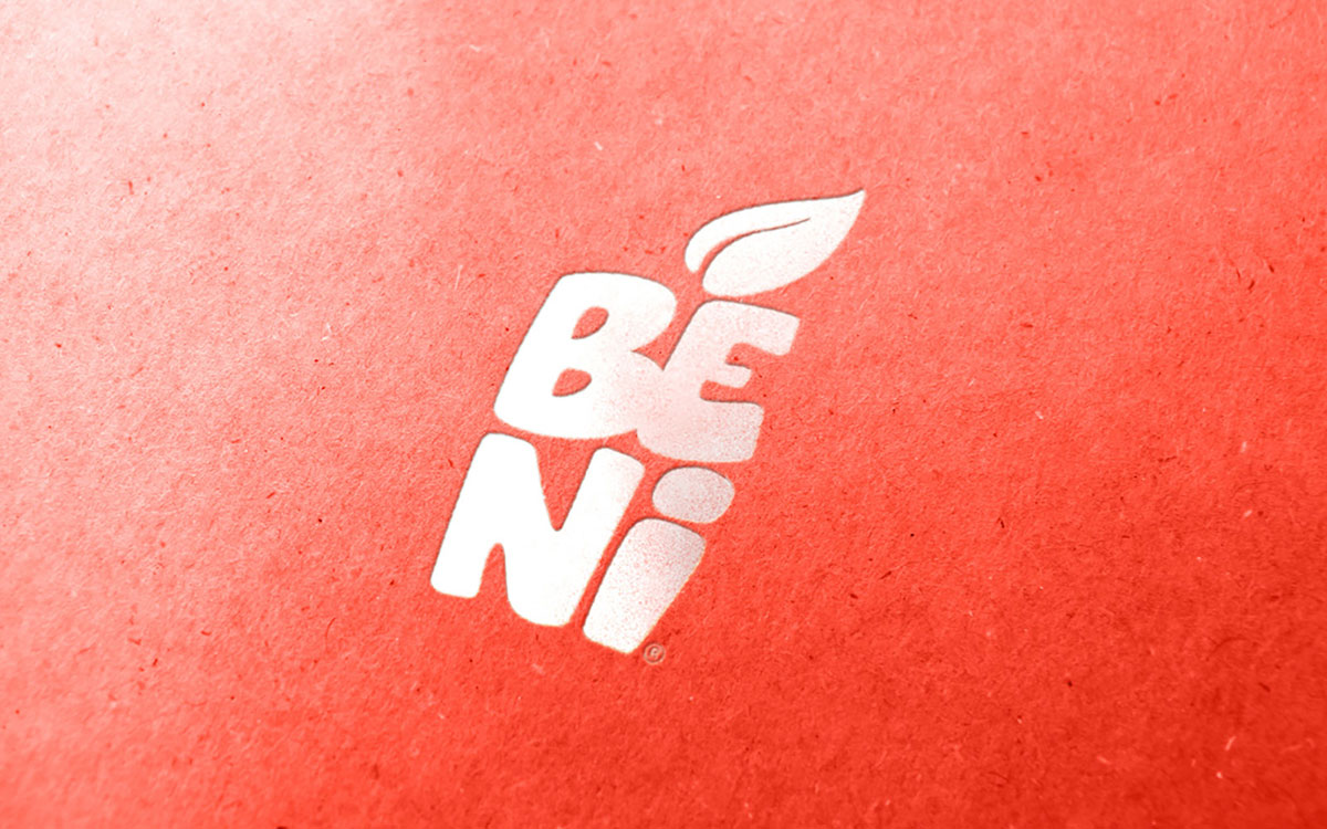 The Beni logo in white, pressed into red kraft paper