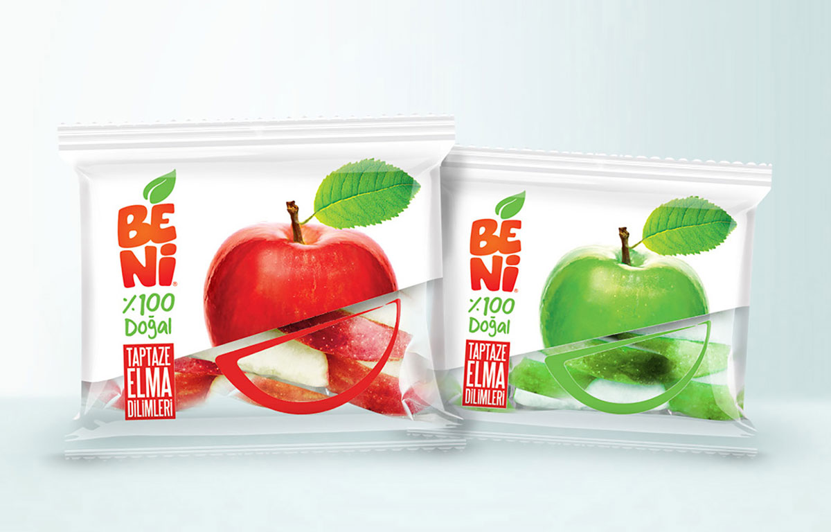 Two Beni packs of apple slices, one red and one green, each with a clear window showing the fruit