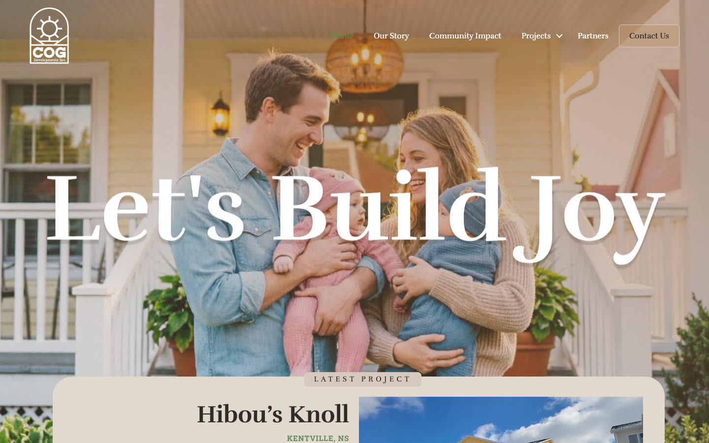 The COG Developments home page: the headline Let's Build Joy over a couple holding their baby on a porch